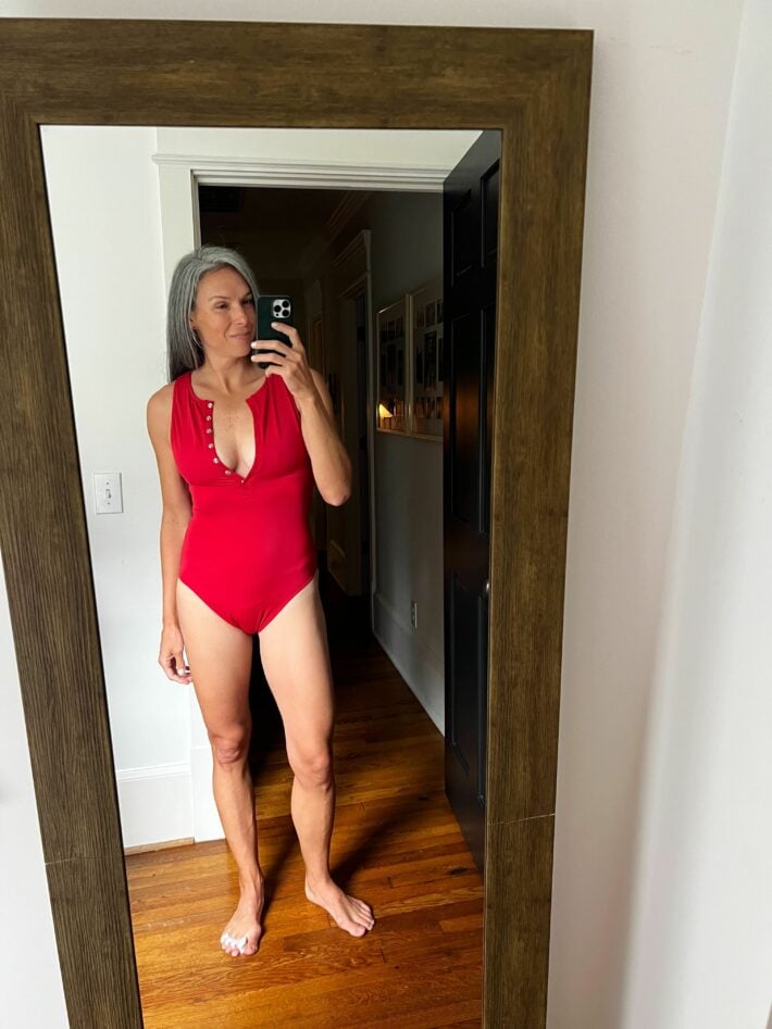 A woman in a red swimsuit.