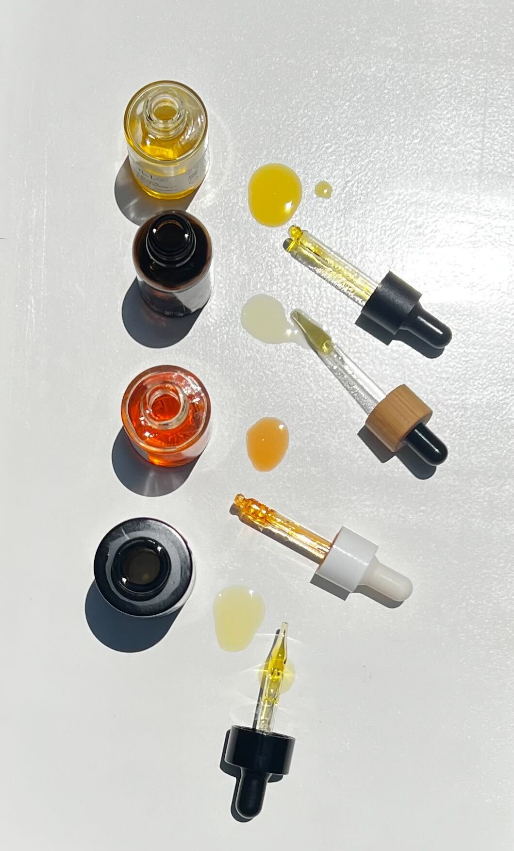 A collection of plum oils with their droppers.
