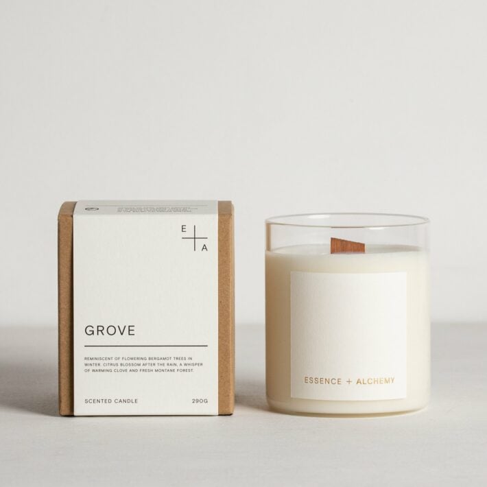 An Essence + Alchemy candle and box.