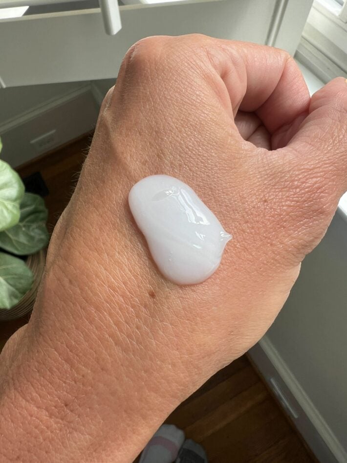 A dollop of conditioner on a hand. 
