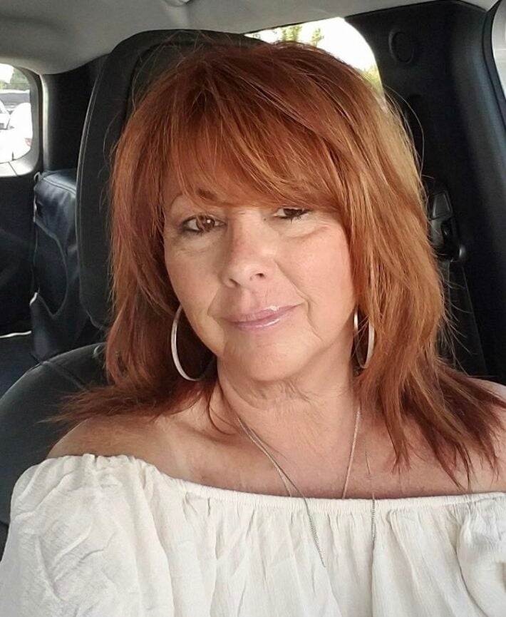 A selfie of a woman with red hair. 