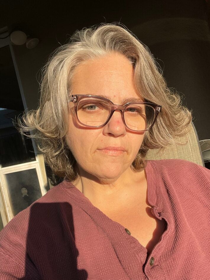 A selfie of a woman with gray hair. 